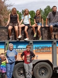 Some of Canon School students with Alfie and North Valley Junk Removal staff