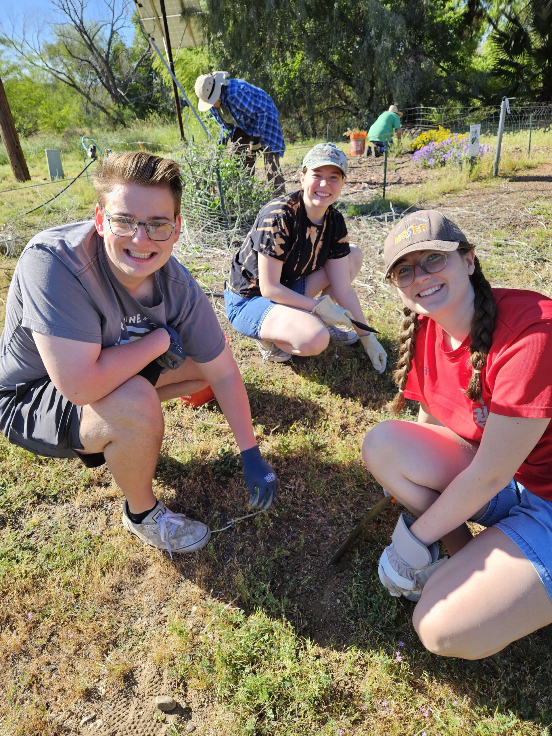 Volunteers removing invasives and having fun. 